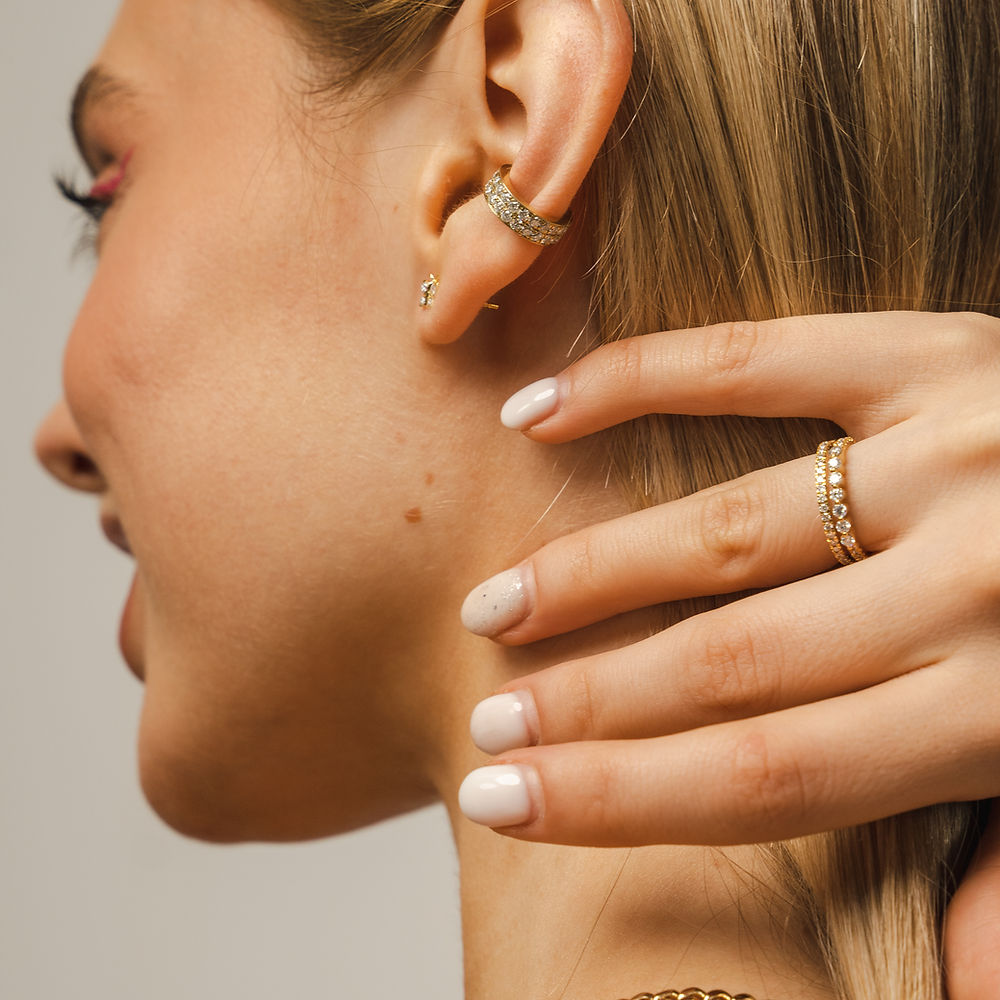 Gold vermeil 'no-piercing' ear cuff by BLOOMTINE with premium lab-grown moissanites. This adjustable, tarnish-resistant double hoop cuff features 14K gold over sterling silver and a high-refractive index sparkle that stays brilliant against lotions and oils