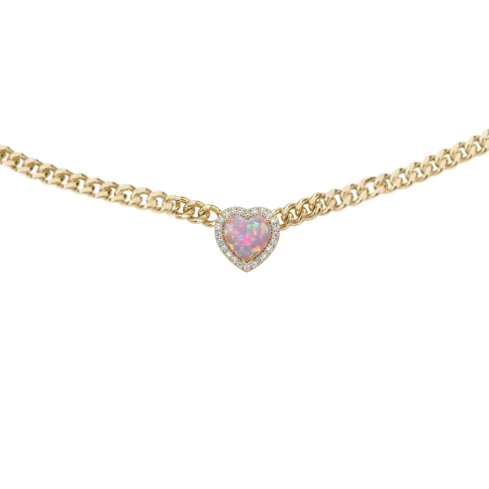 Gold necklace with a heart-shaped pink gemstone on a white background
