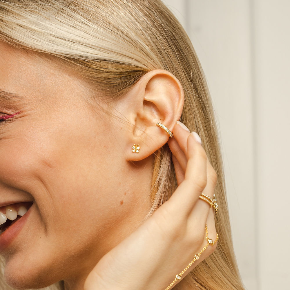 Petite 5x5mm butterfly silver studs by BLOOMTINE set with 8 sustainable moissanites. These hypoallergenic, tarnish-resistant sterling silver earrings offer a minimalist silhouette for daily wear, making them a perfect graduation or birthday gift