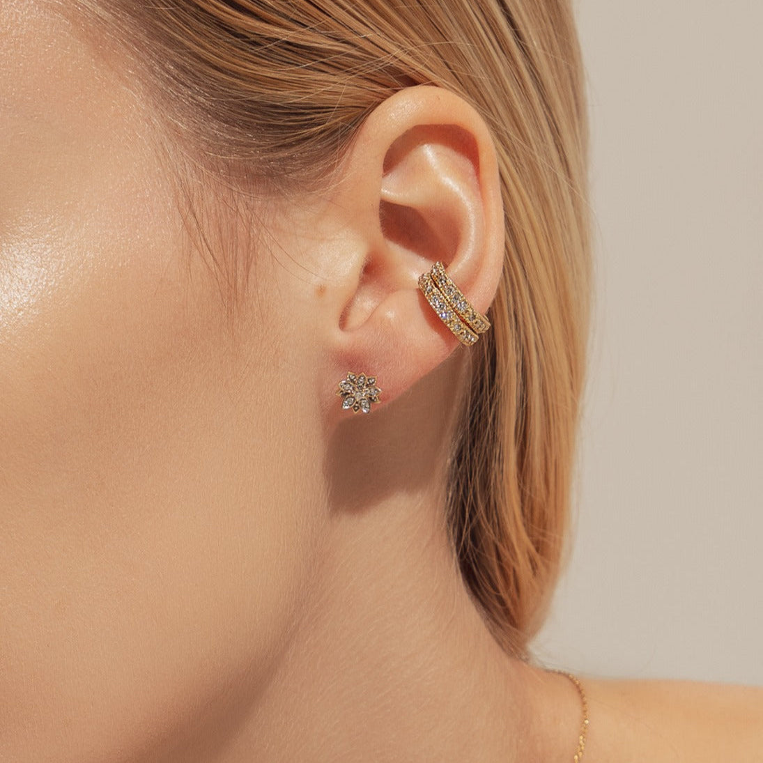 Eternal Bloom™ 14K Diamond Lotus Flower Earrings image 1. BLOOMTINE Eternal Bloom™ 14K Solid Gold Lotus Earrings featuring 12 VS1 clarity natural diamonds. These 3D layered flower studs are handcrafted in London as a symbol of spiritual awakening, offering a lifelong investment in luxury and extraordinary brilliance