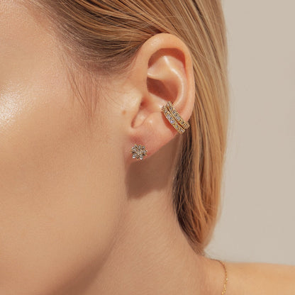 Eternal Bloom™ 14K Diamond Lotus Flower Earrings image 1. BLOOMTINE Eternal Bloom™ 14K Solid Gold Lotus Earrings featuring 12 VS1 clarity natural diamonds. These 3D layered flower studs are handcrafted in London as a symbol of spiritual awakening, offering a lifelong investment in luxury and extraordinary brilliance