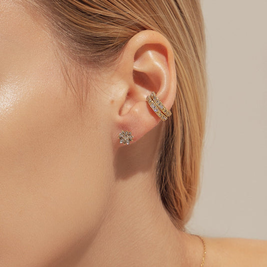 Eternal Bloom™ 14K Diamond Lotus Flower Earrings image 1. BLOOMTINE Eternal Bloom™ 14K Solid Gold Lotus Earrings featuring 12 VS1 clarity natural diamonds. These 3D layered flower studs are handcrafted in London as a symbol of spiritual awakening, offering a lifelong investment in luxury and extraordinary brilliance