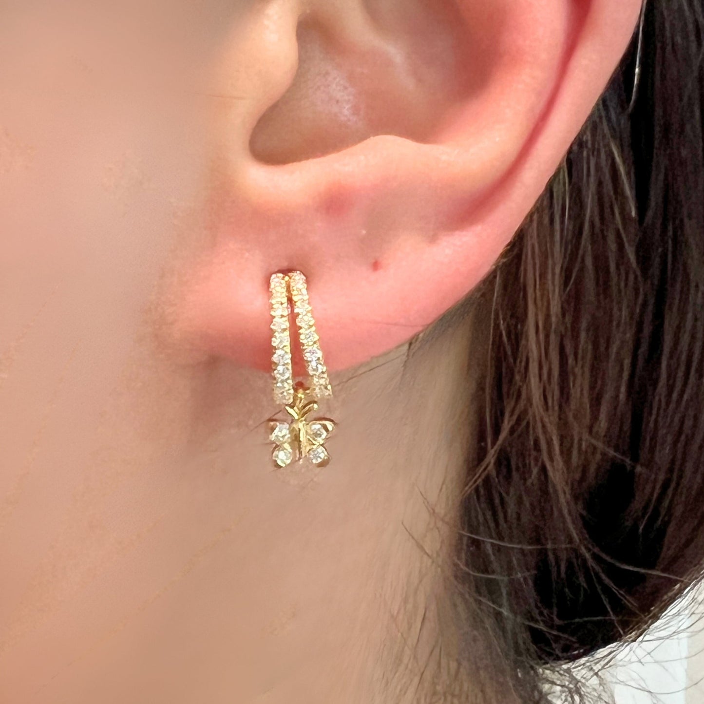 Enchanting Flutterfly™ Gold Vermeil Butterfly Huggies image 2. 14K Gold Vermeil butterfly huggie hoops by BLOOMTINE. Crafted with a thick gold layer over sterling silver and hand-set with sustainable moissanites, these ethical, tarnish-resistant earrings are a perfect 'Spirit of Evolution' talisman for everyday luxury