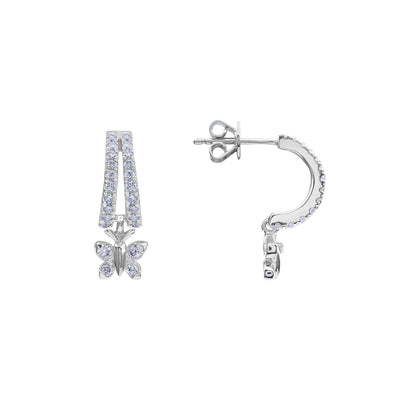 BLOOMTINE Enchanting Flutterfly™ Butterfly Huggies in premium sterling silver. Coated in tarnish-resistant white rhodium for a mirror-like shine, these moissanite-studded hoops symbolize transformation and resilience with extraordinary light refraction
