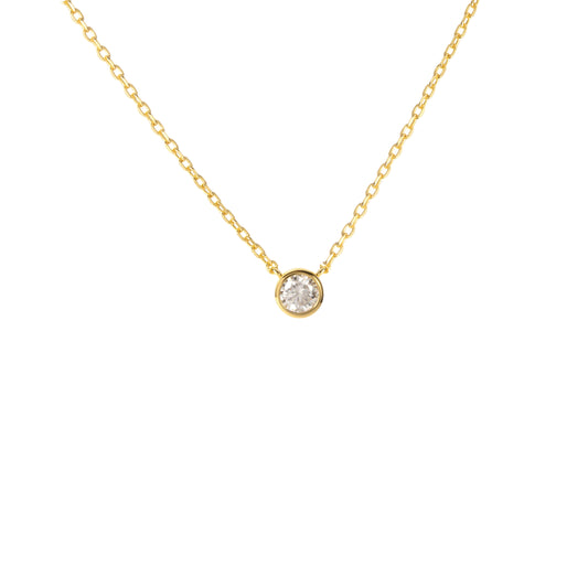 Minimalist gold solitaire necklace by BLOOMTINE with a small round lab-grown diamond. This tarnish-resistant 18k gold vermeil piece offers a sustainable, high-brilliance alternative to mined diamonds, perfect for layering as a dainty goddess staple