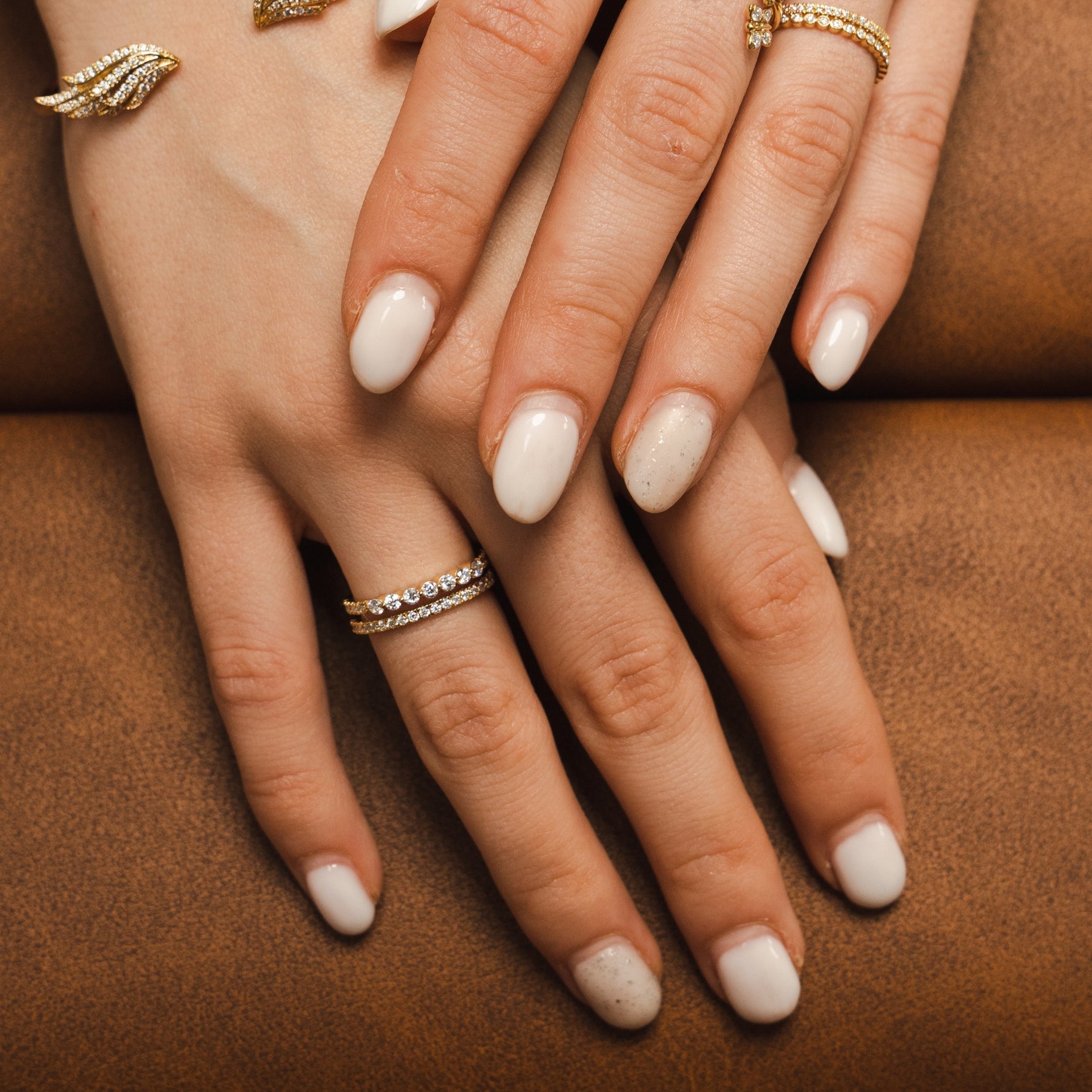 A Bloomtine signature 925 sterling silver ring with brilliant-cut lab moissanites. This tarnish-resistant, rhodium-plated 'Combi' design features a copyrighted architecture that mimics a multi-ring stack. An ethical luxury jewelry piece available at Wolf & Badger and House of Fraser