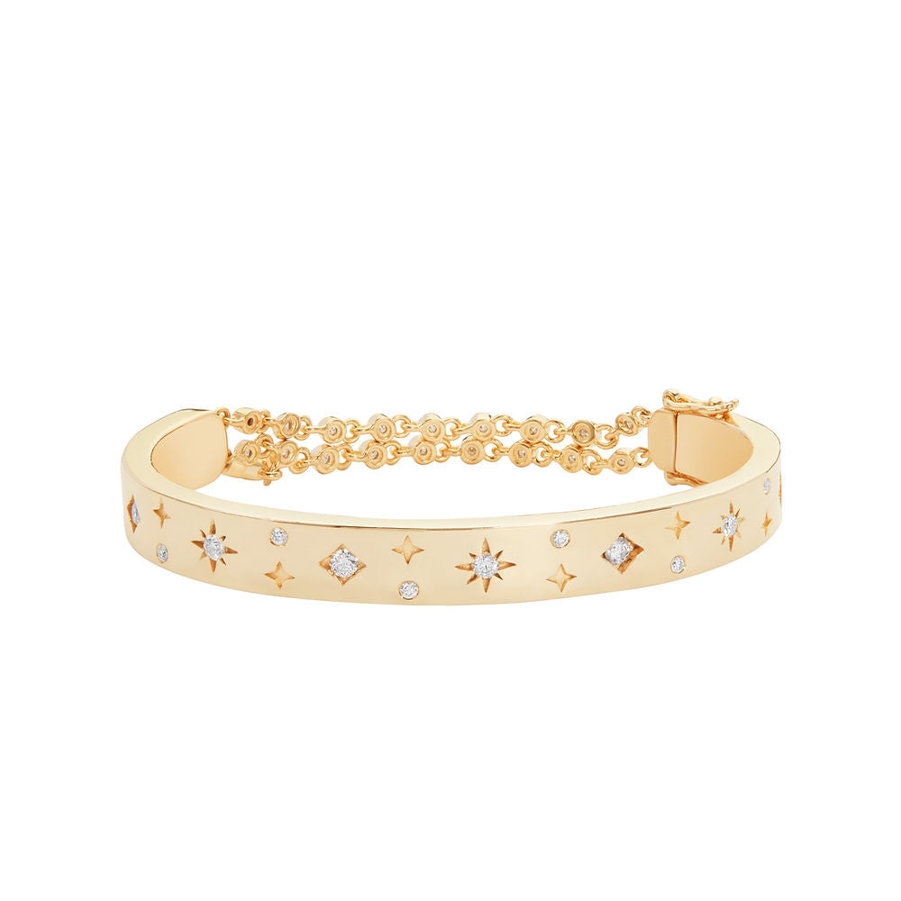 Illuminess™ Premium Gold Vermeil Starset Bangle. The BLOOMTINE Illuminess™ Starset Bangle in 14K Gold Vermeil. Featuring a 35g solid silver base and star-set lab moissanites, this abundance talisman is engraved with 'You are Magic' to symbolize financial flow, success, and personal empowerment