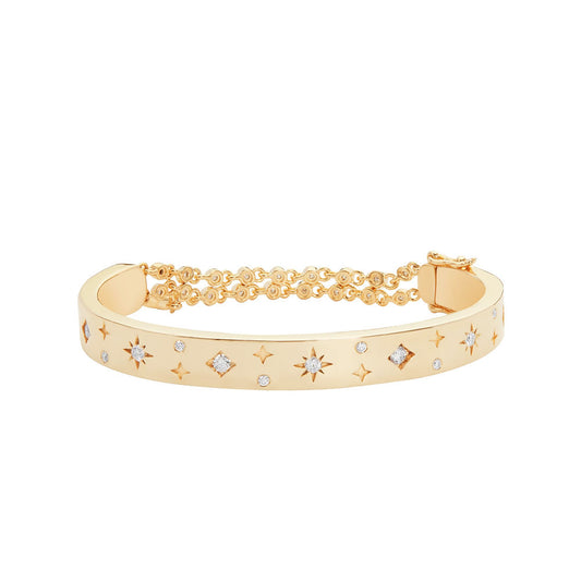 Illuminess™ Premium Gold Vermeil Starset Bangle. The BLOOMTINE Illuminess™ Starset Bangle in 14K Gold Vermeil. Featuring a 35g solid silver base and star-set lab moissanites, this abundance talisman is engraved with 'You are Magic' to symbolize financial flow, success, and personal empowerment