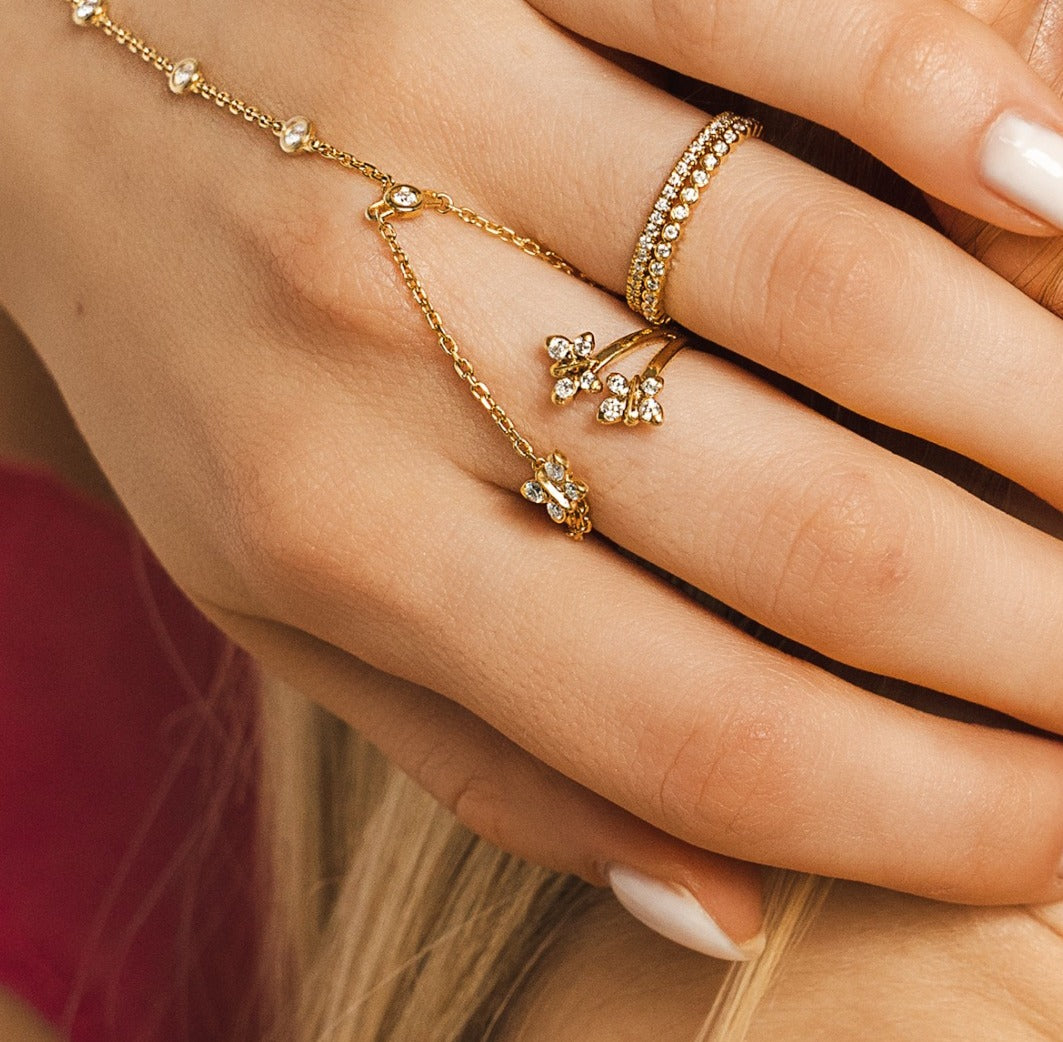 Enchanting Flutterfly™ Gold Vermeil Trio Butterfly Ring image 2. 14K gold-vermeil sterling silver trio butterfly ring by BLOOMTINE. Featuring 12 brilliant-cut sustainable moissanites and a tarnish-resistant gold vermeil finish, this dainty yet impactful ring is perfect for stacking or as a meaningful graduation gift for extraordinary humans.