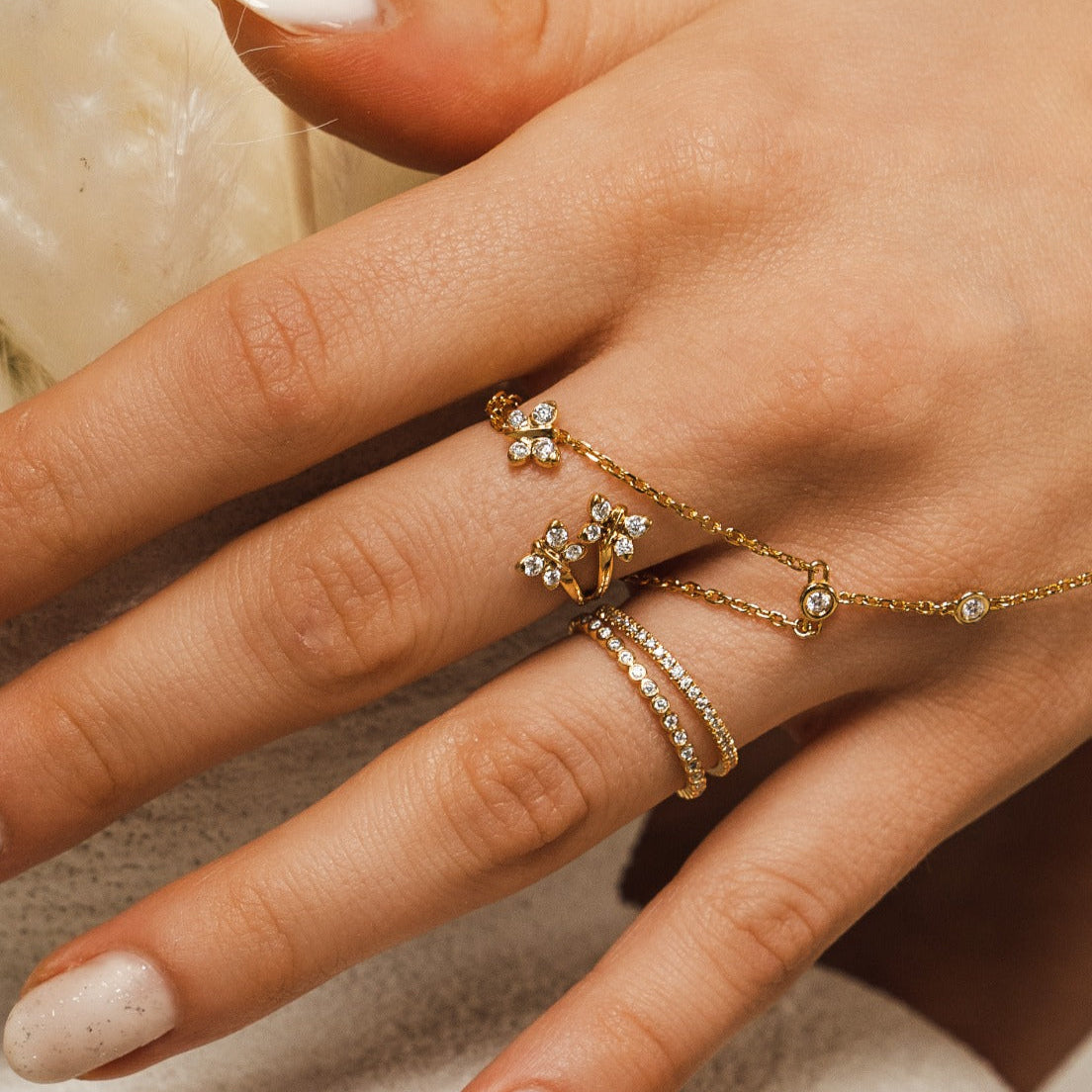 Enchanting Flutterfly™ Gold Vermeil Trio Butterfly Ring image 1. The BLOOMTINE Trio Butterfly Ring in 14K Gold Vermeil. Featuring three delicate butterflies hand-set with 12 scintillating lab-grown moissanites, this symbolic ring represents triple the grace and resilience, finished with a rich auric glow for the extraordinary human