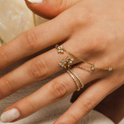 Enchanting Flutterfly™ Gold Vermeil Trio Butterfly Ring image 1. The BLOOMTINE Trio Butterfly Ring in 14K Gold Vermeil. Featuring three delicate butterflies hand-set with 12 scintillating lab-grown moissanites, this symbolic ring represents triple the grace and resilience, finished with a rich auric glow for the extraordinary human