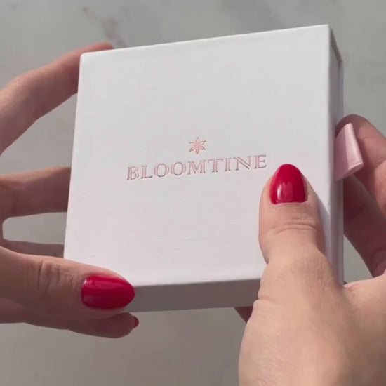 The BLOOMTINE Illuminess™ Starset Bangle in heavy 14K Gold Vermeil. Featuring 4-point and 8-point stars set with brilliant moissanites and an interior 'You are Magic' engraving, this 35g solid silver talisman is designed to manifest abundance and success